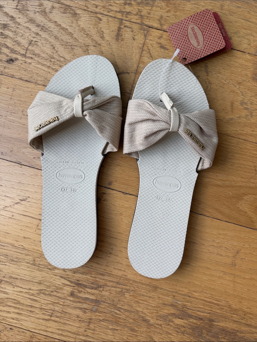 Havaianas Women's Bow Slide Sandals in Light Beige gold metallic 7/8 37-38